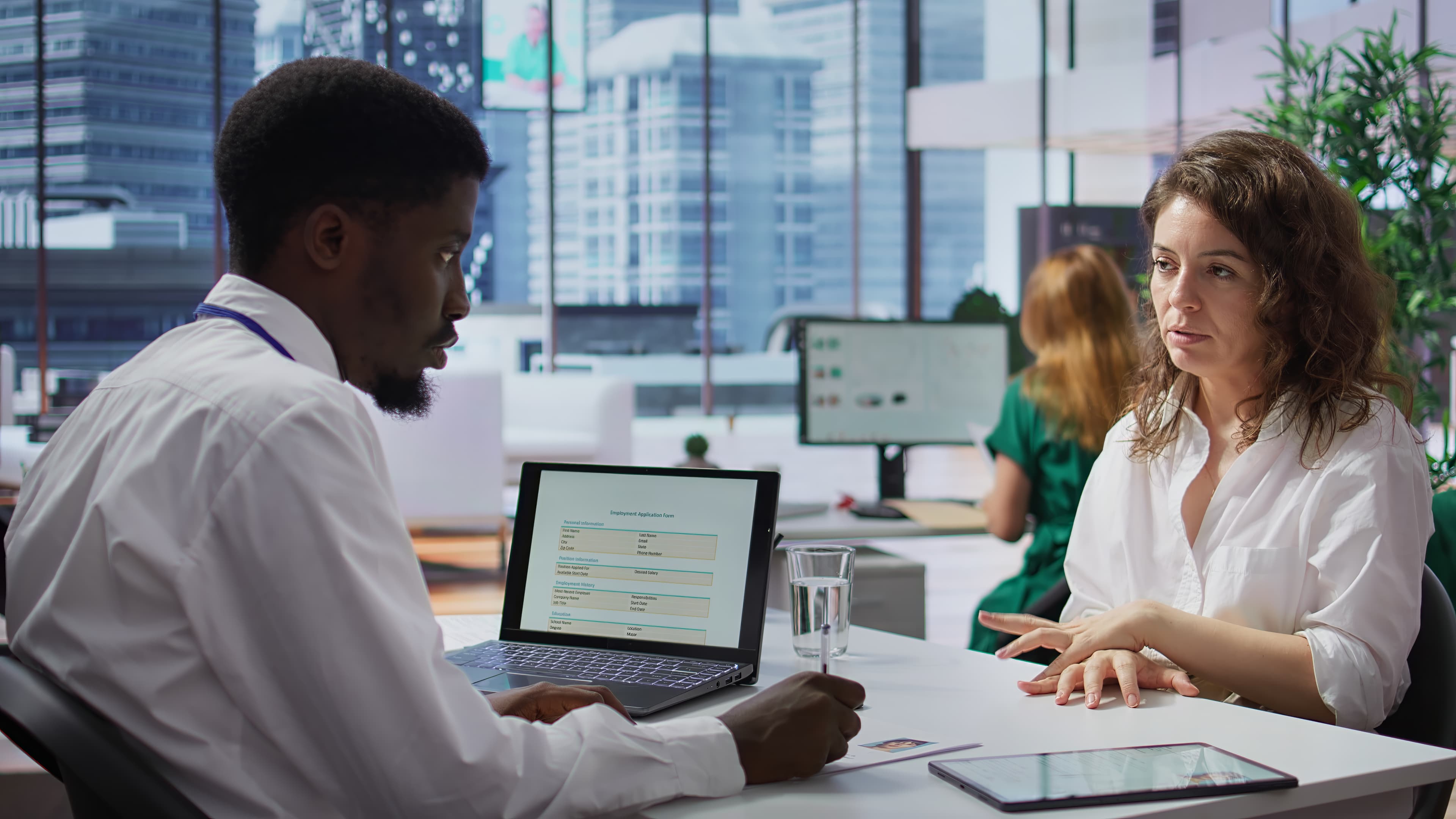 Connect Outsourcing partners in conversation with a city skyline behind them